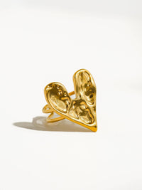 A front view of the gold ring displaying its abstract heart shape and polished finish, emphasizing its unique and elegant aesthetic.