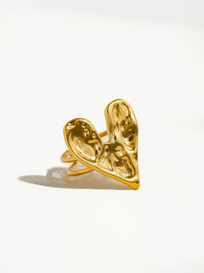 A front view of the gold ring displaying its abstract heart shape and polished finish, emphasizing its unique and elegant aesthetic.