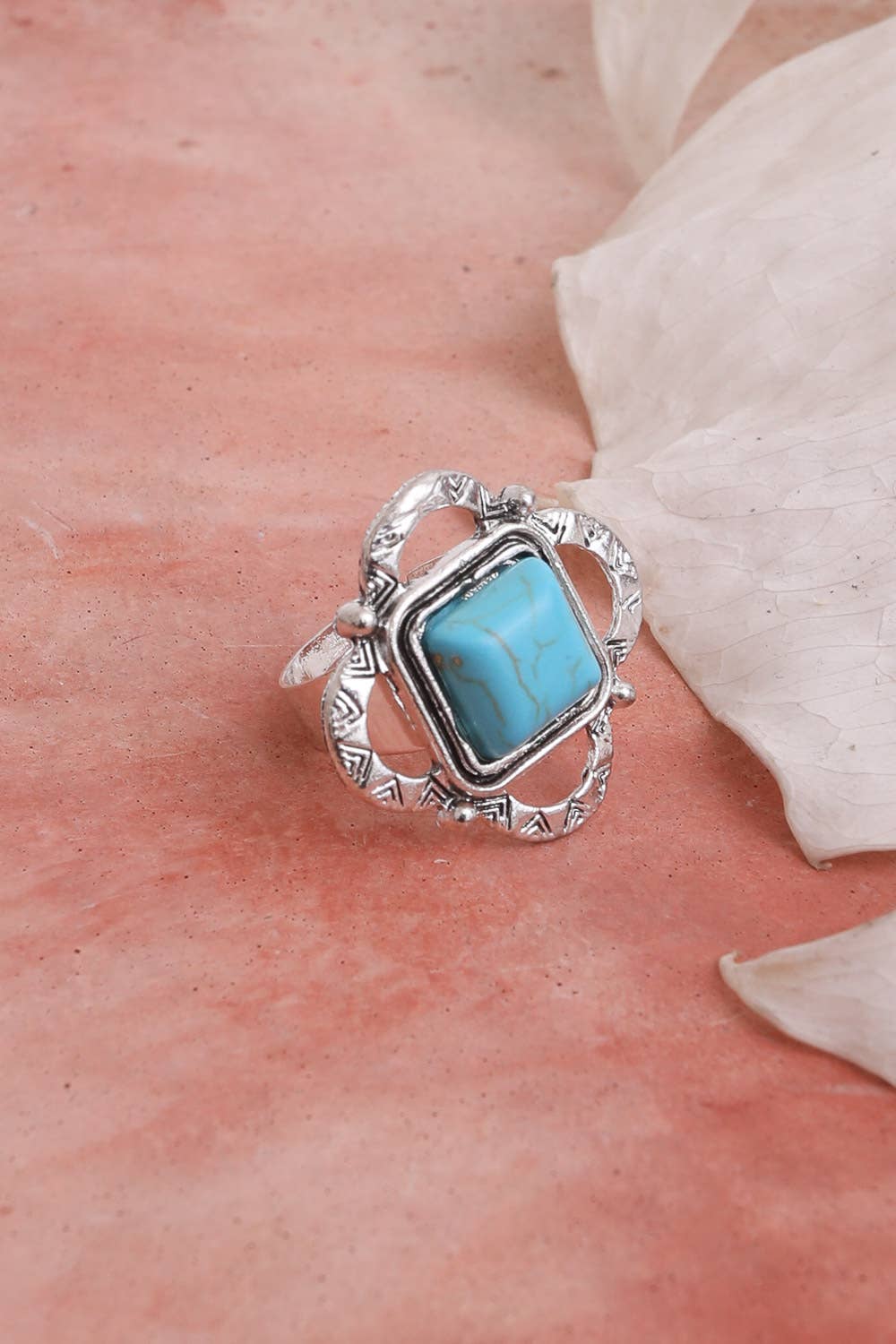 Square Cut Adjustable Turquoise Ring on table