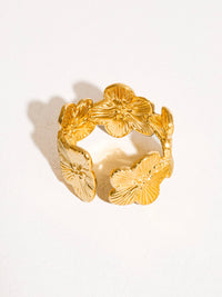 Gold adjustable floral ring featuring detailed hibiscus-inspired petals