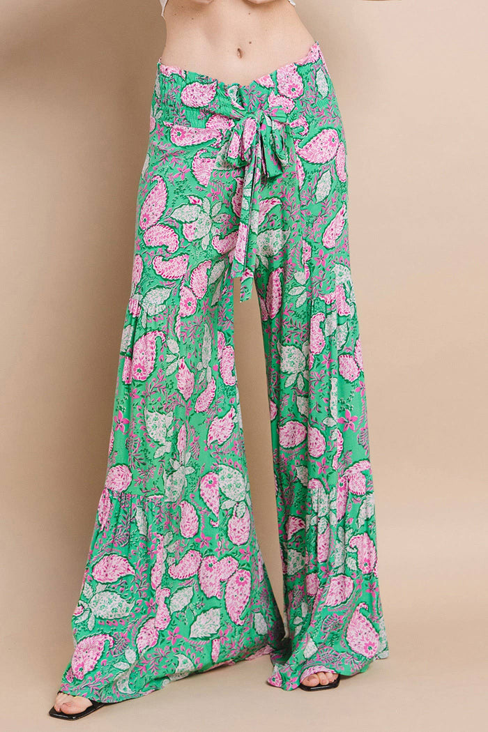 Front view of boho palazzo pants with a tied sash, featuring a dramatic wide-leg silhouette 