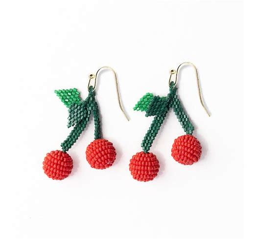 Close-up of Lottie Cluster Dangle Luxe Earrings – handcrafted beaded cherry earrings with gold hooks against a white background.