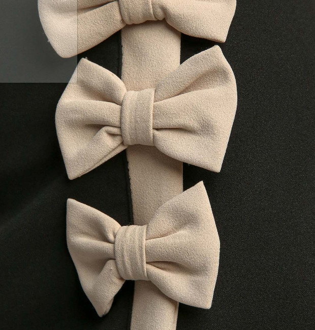 close up of bows on side of front skirt