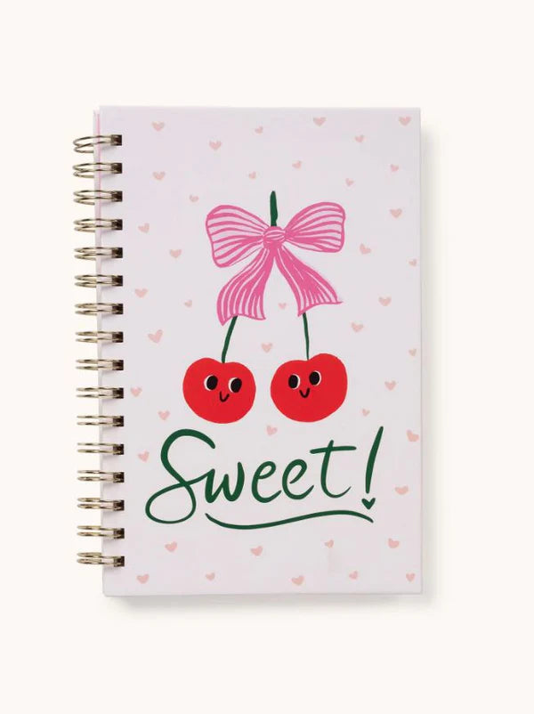 Front cover of the Sweetest Cherry Spiral Notebook featuring a cute cherry duo with a pink bow and heart accents.