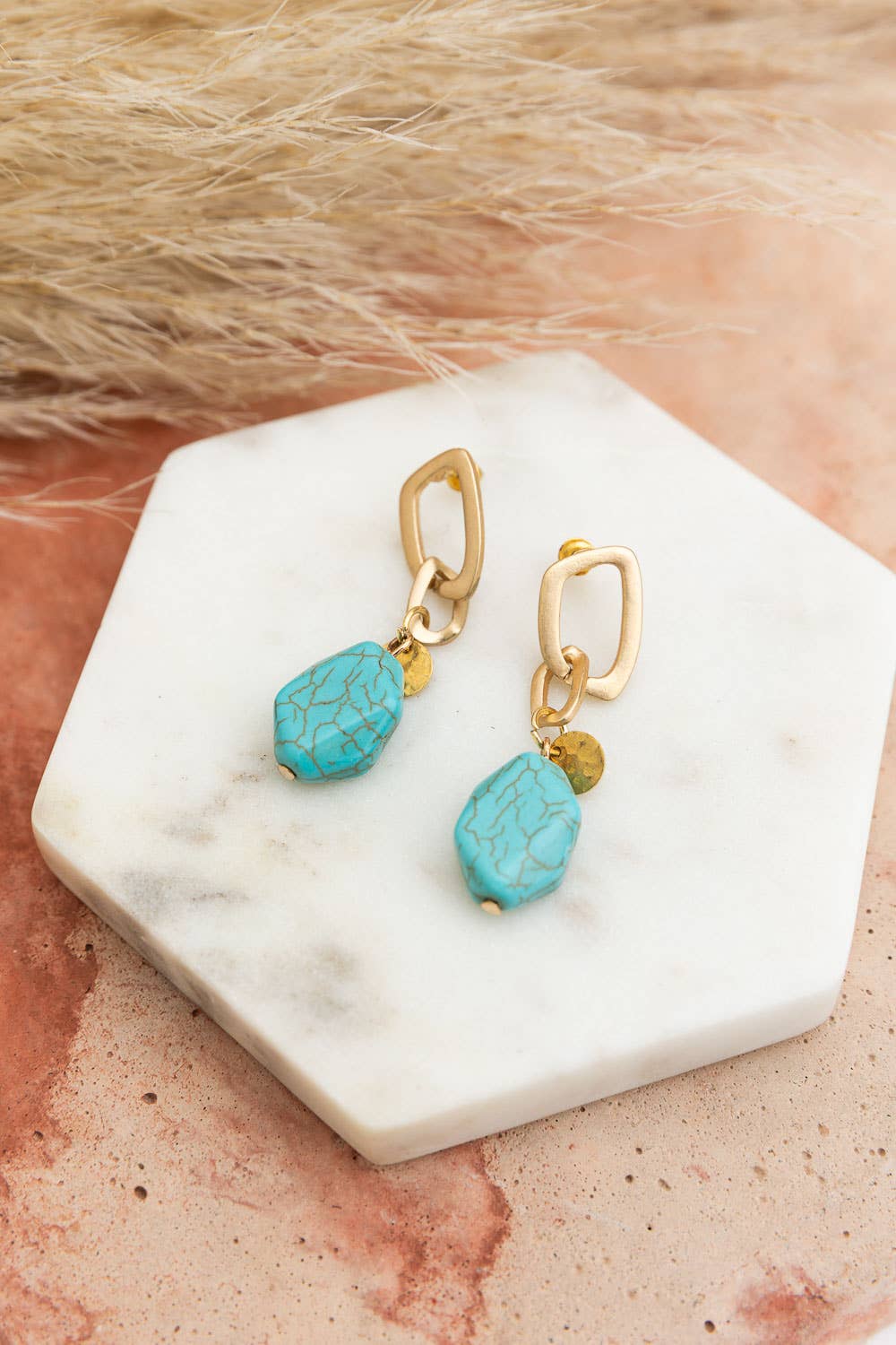 Turquoise Stone Drop Chain Earrings on Display stand