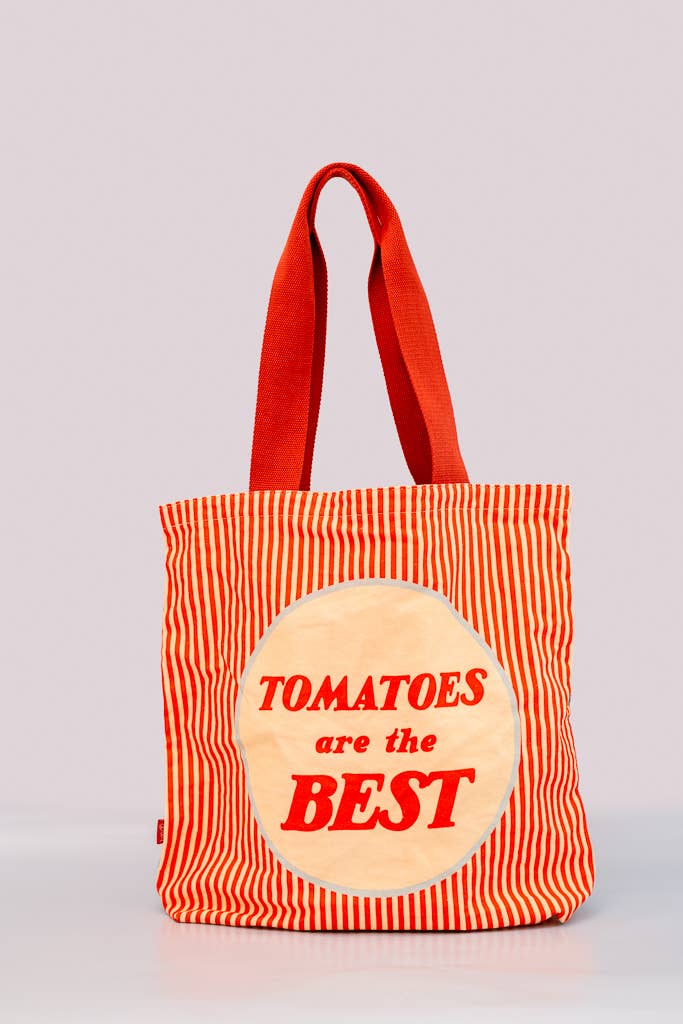 Canvas tote bag with red and white stripes and the phrase 'Tomatoes are the Best' printed in bold red letters on a cream circular design